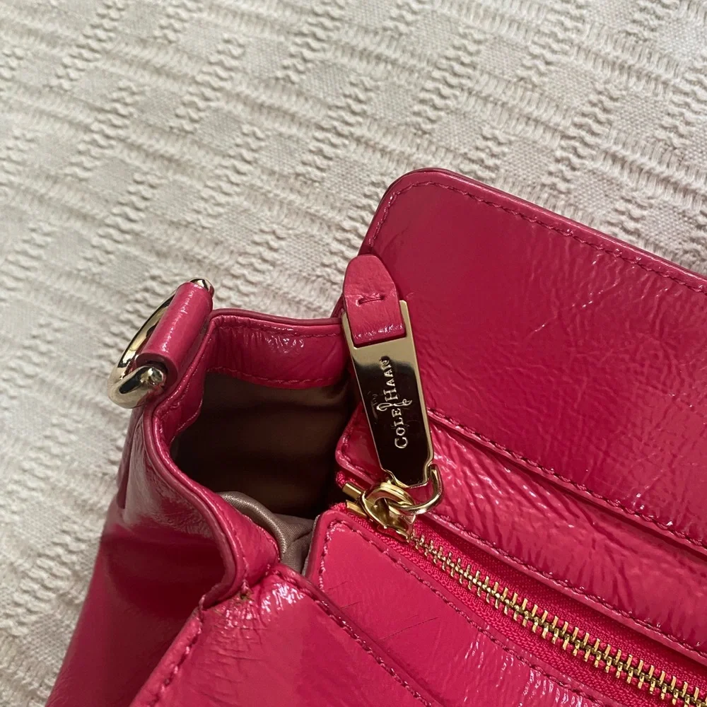 Cole Haan pink patent leather purse.